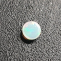 Opal z Etiopii kaboszon fi 7 mm nr 421