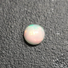 Opal z Etiopii kaboszon fi 7 mm nr 432