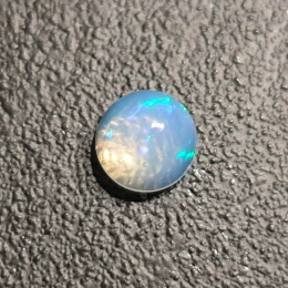 Opal z Etiopii kaboszon fi 7 mm nr 434