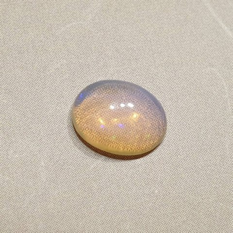 Opal z Etiopii kaboszon 8,87x7,03 mm nr 136