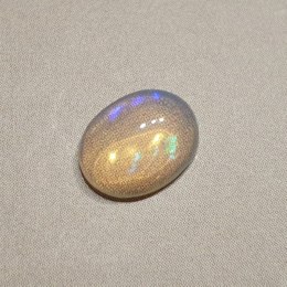 Opal z Etiopii kaboszon 8,90x6,81 mm nr 129